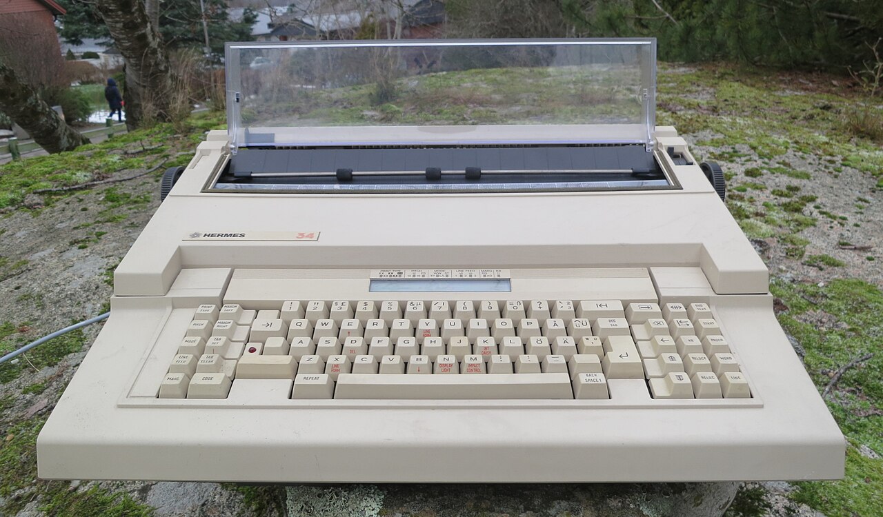 A 1980s Hermes 34 electric typewriter, showing the heavier form factor of power-driven machines.